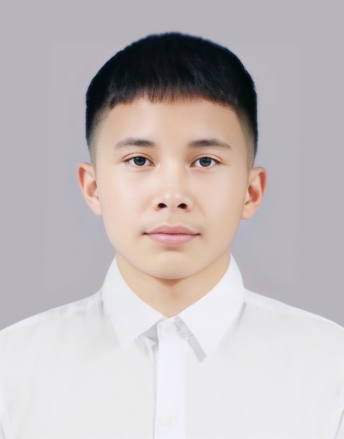 Portrait of Poramet Obyam in a white shirt